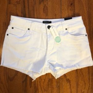 STS Blue white denim shorts with frayed hem.